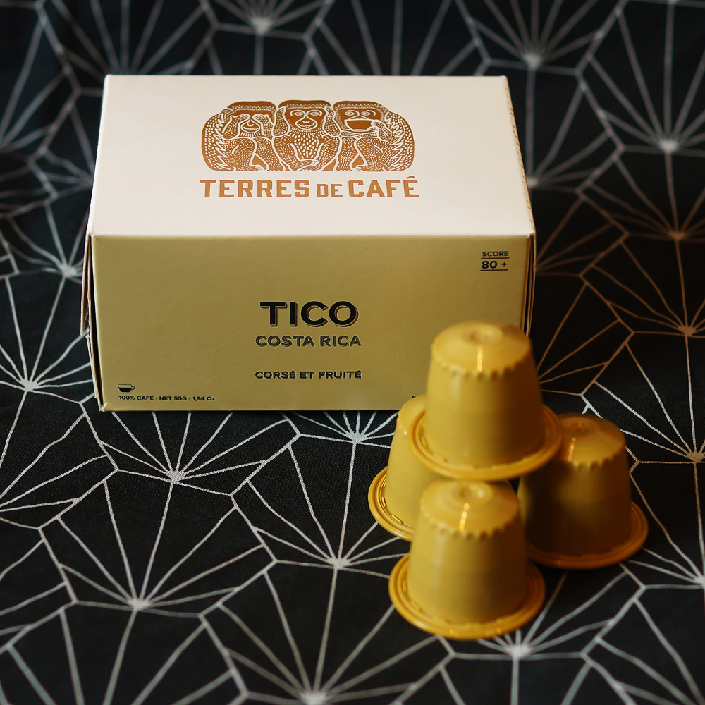 Tico, Costa Rica by Terres de Café - yellow capsules with the box on a dark background