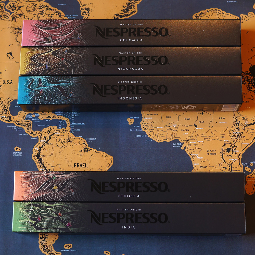 New Nespresso Master Origin capsules - five coffee boxes on a map as a background