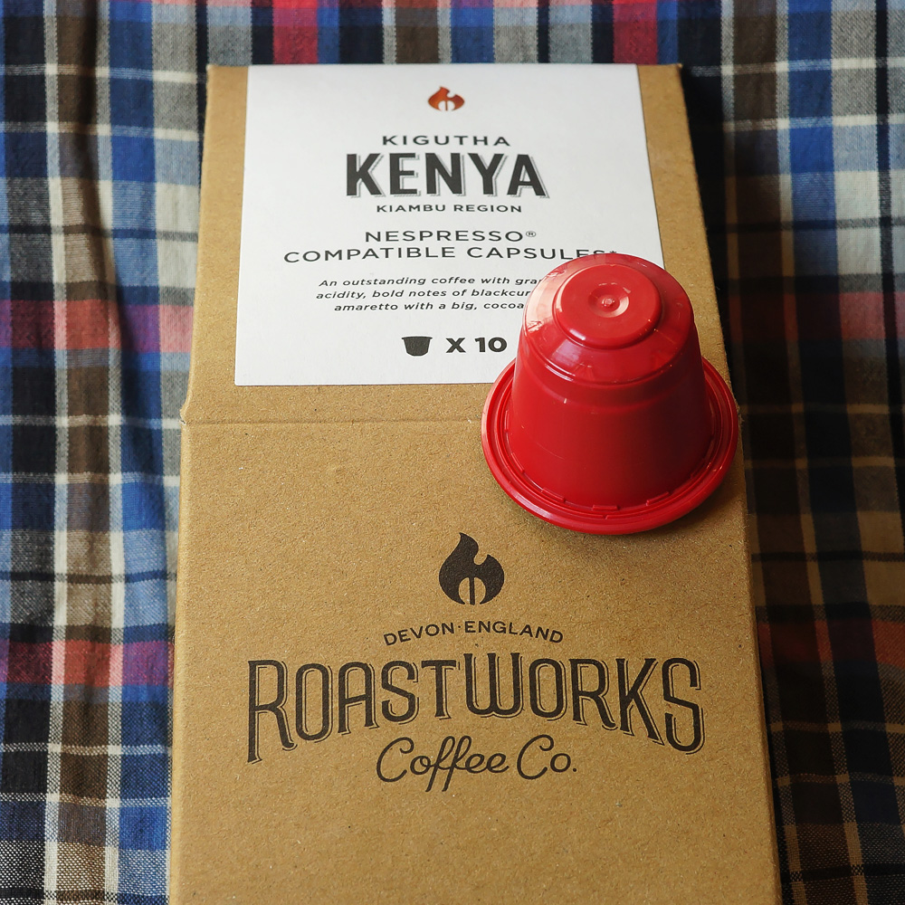 Kenya by Roastworks - a single red coffee capsule on a brown paper backaging