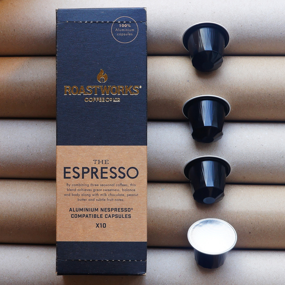 The Espresso (new) by Roastworks Coffee Co. - Four black coffee capsules and a blue box 
